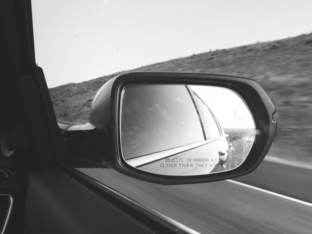 Reflection of the rear view mirror of a car